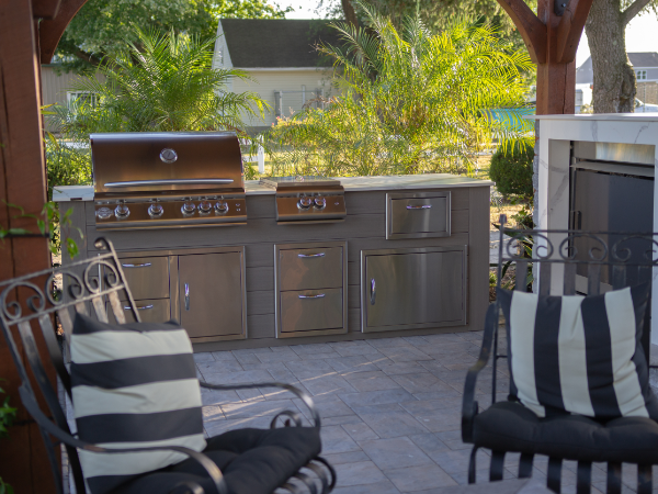 Cozy outdoor kitchen with beautiful fireplace!